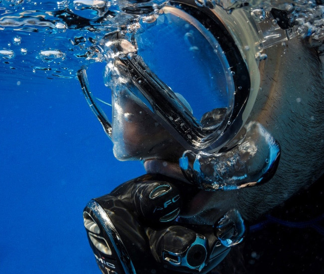side view of scuba diver with mask on