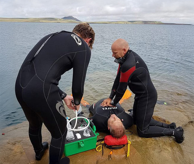rescue diver giving CPR
